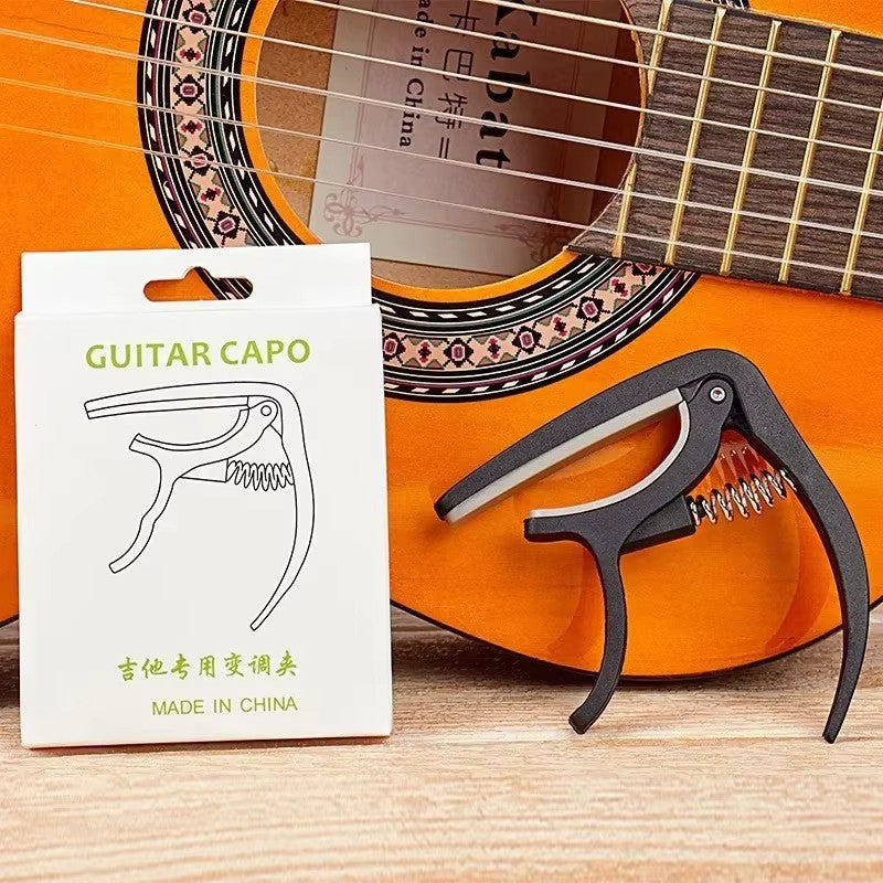 Kit 4 em 1 para Violão e Guitarra – 1 Afinador Digital + 1 Capotraste + 5 Palhetas + 1 Correia com Porta Palhetas